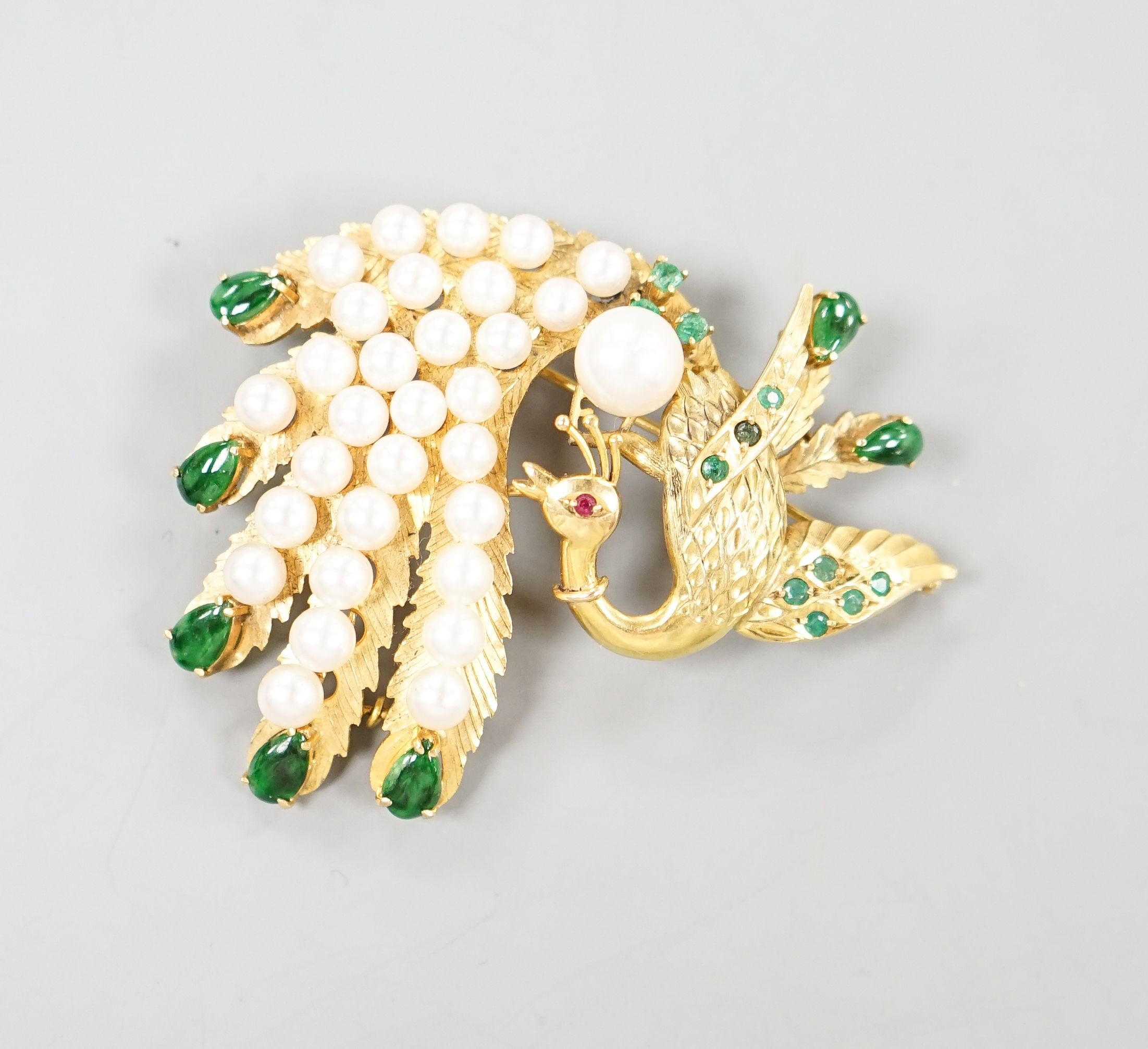 A 14k gold, emerald, graduated cultured pearl and green enamel set peacock brooch, 58mm